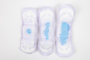 three bladder control pads showing absorbency levels