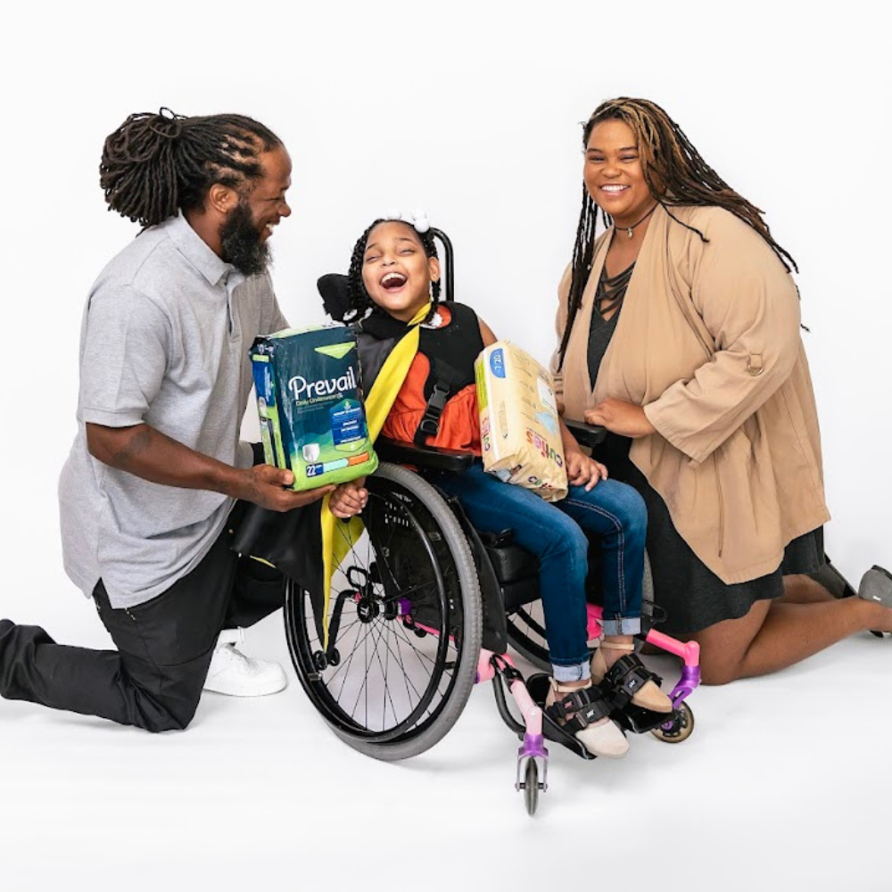 parents with child holding diapers