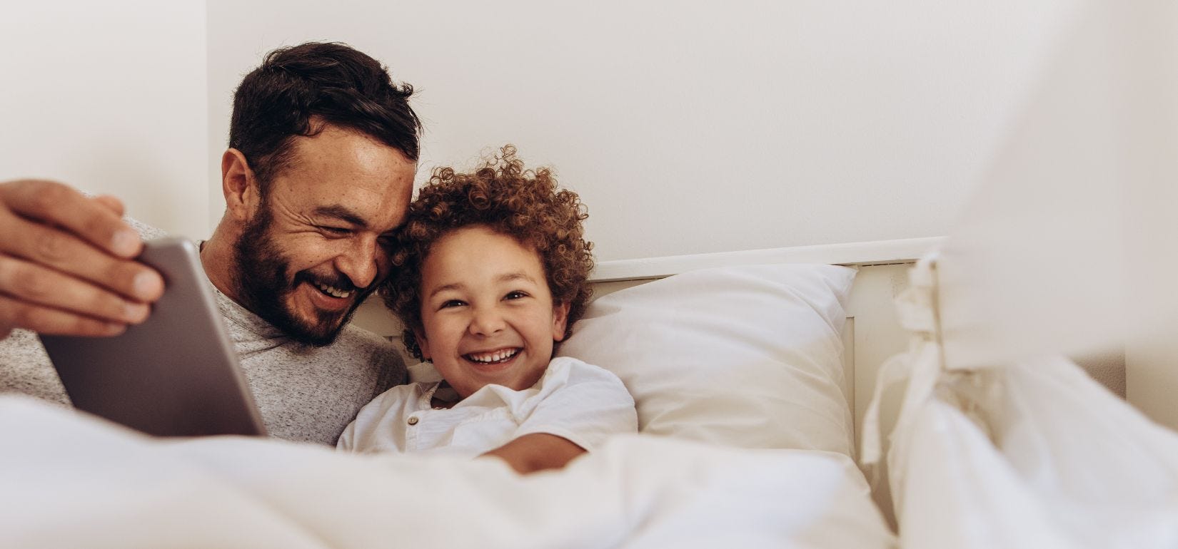 Dad and child with adhd in bed