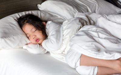 Child sleeping in bed