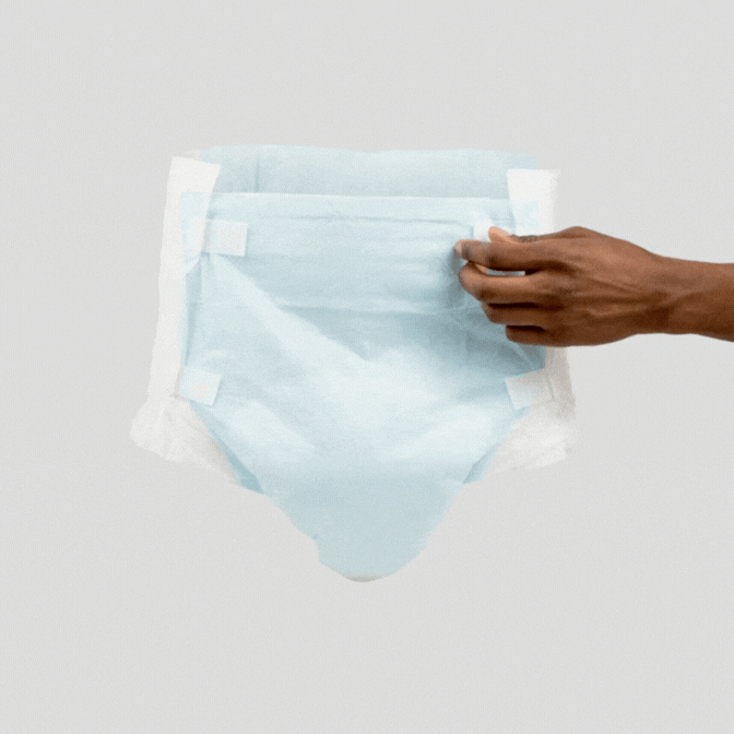 adult diaper being opened by tabs