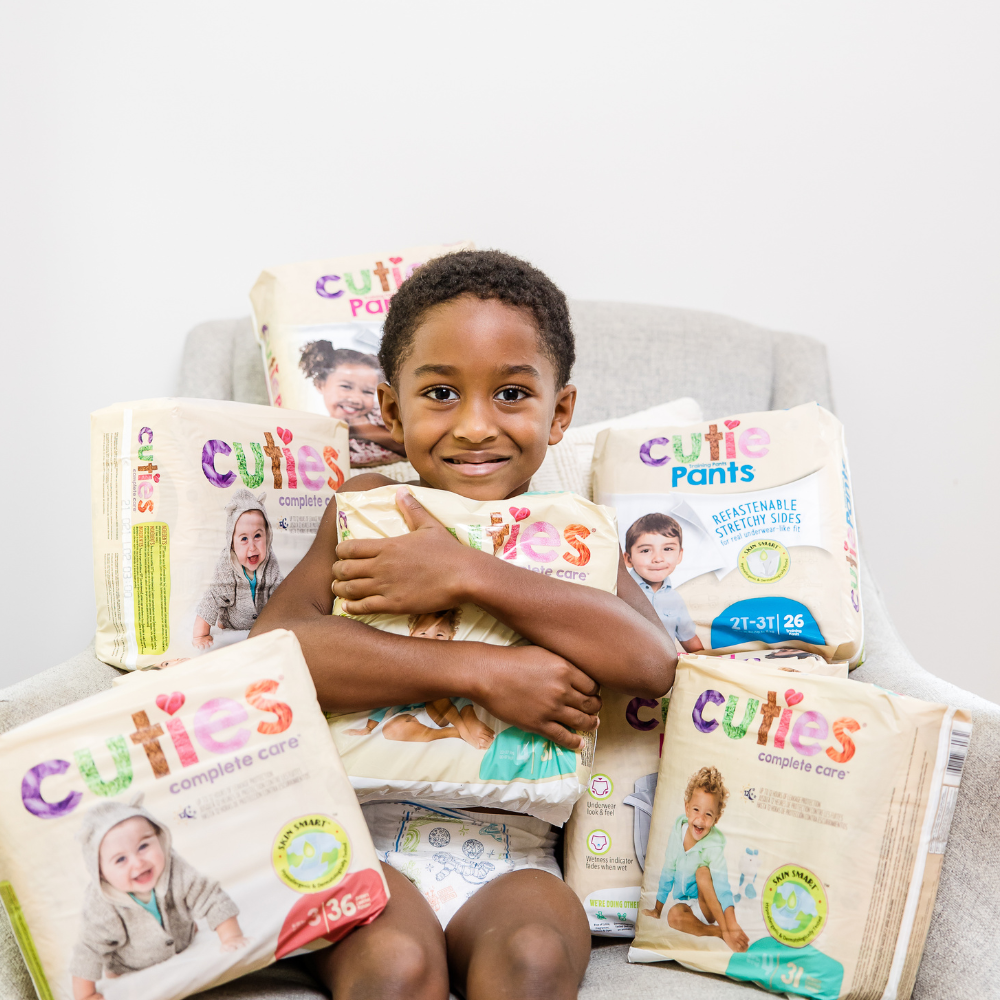 boy holding diapers