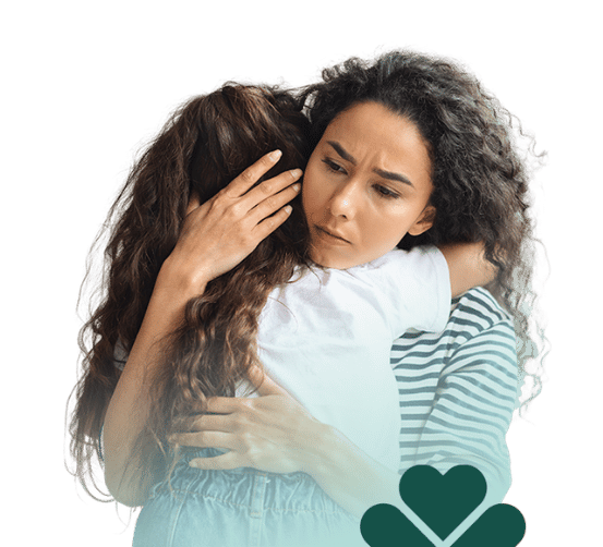 cargiver hugging loved one with mint gradient