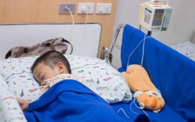 Child in bed for spina bifida