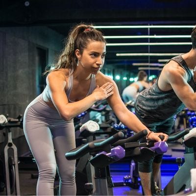 Woman cycling for exercise