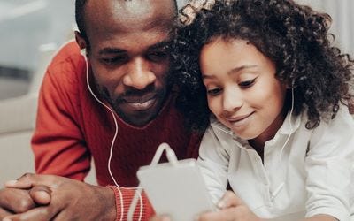 Dad helping his daughter with incontinence at night