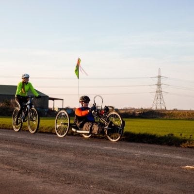 Disability pride flag on bike