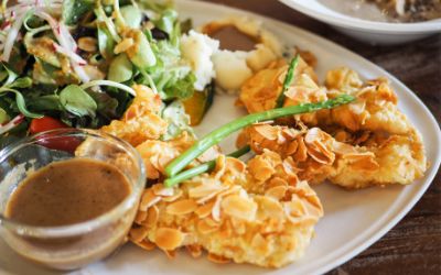 fish sticks with a side of vegetables and dipping sauce