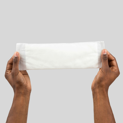 hands holding a booster pad