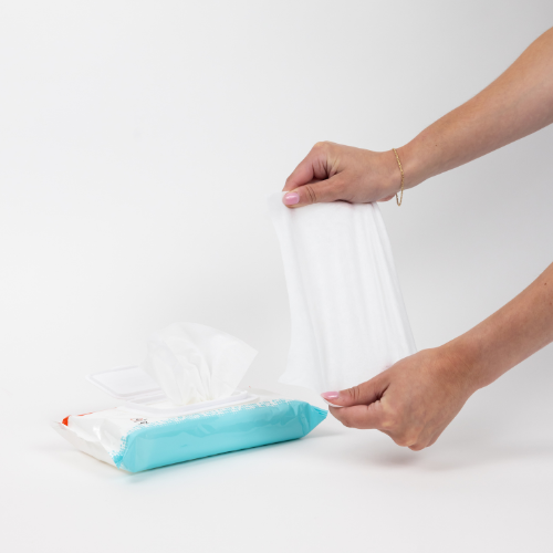 hands holding incontinence wipe