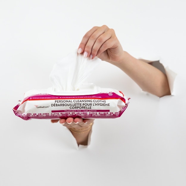 hands holding incontinence wipes