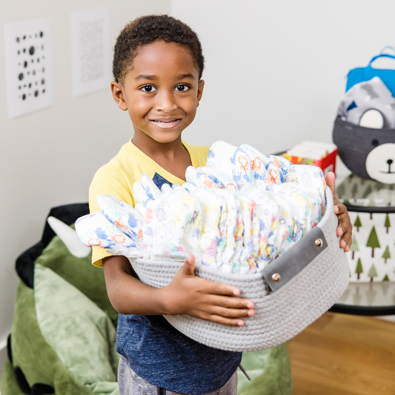 kid holding diapers