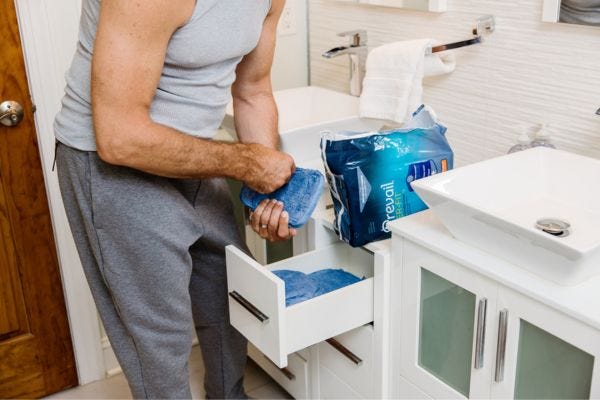 Man looking through incontinence products