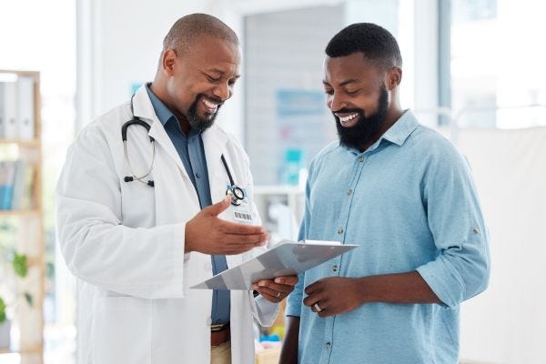 Man talking to a male doctor