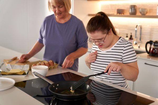 Older child with disability cooking