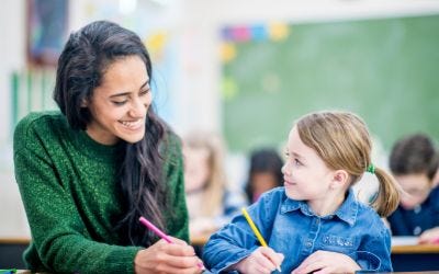 Teacher helping students with incontinence