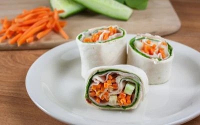 turkey and veggie wrap on plate