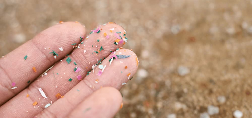 hand holding microplastics