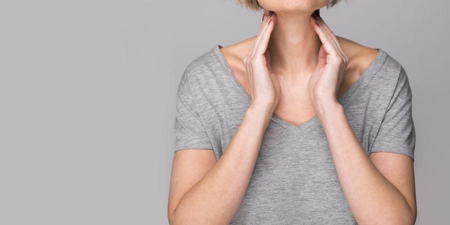 Woman checking thyroid