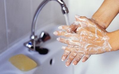 Washing hands to sanitize before catheterization