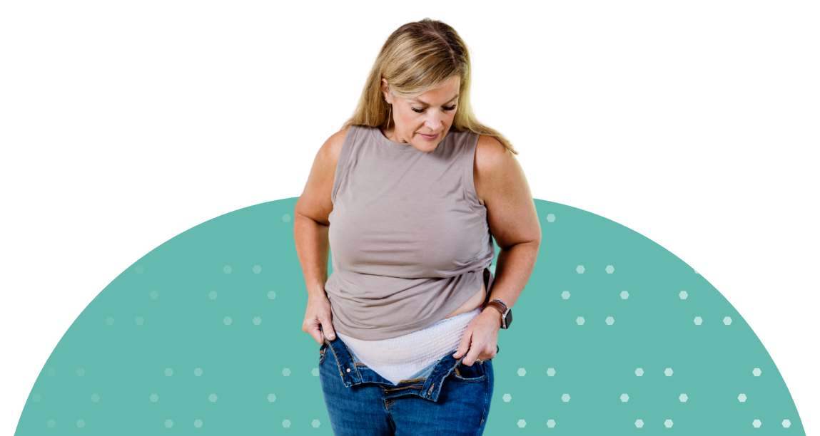 white adult woman pulling pants up with adult diaper on